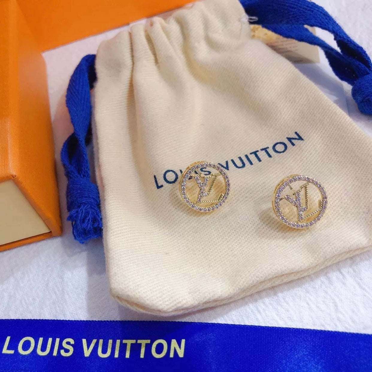 Brinco Louis Vuitton